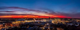 An aerial drone shot of downtown Omaha, NE at sunset