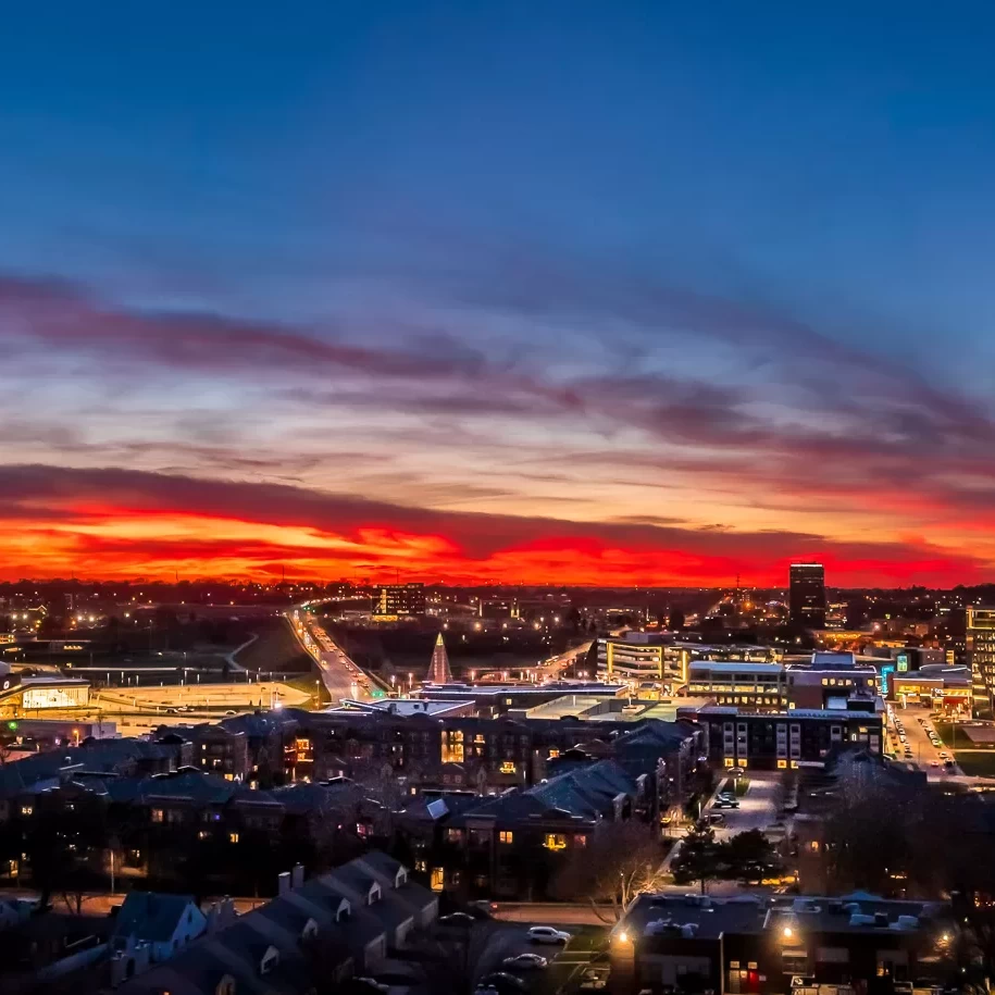 An aerial drone shot of downtown Omaha, NE at sunset