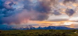 A cloudy sky with mountains in the background, perfect for healthcare photography.