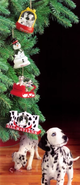 Two dalmatian dogs standing next to a Christmas tree, created for McDonald's and Disney's 101 Dalmations co-promotion.