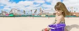 A little girl sitting in the sand with a bucket. COmposite photo