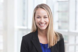 A smiling business woman in a headshot.