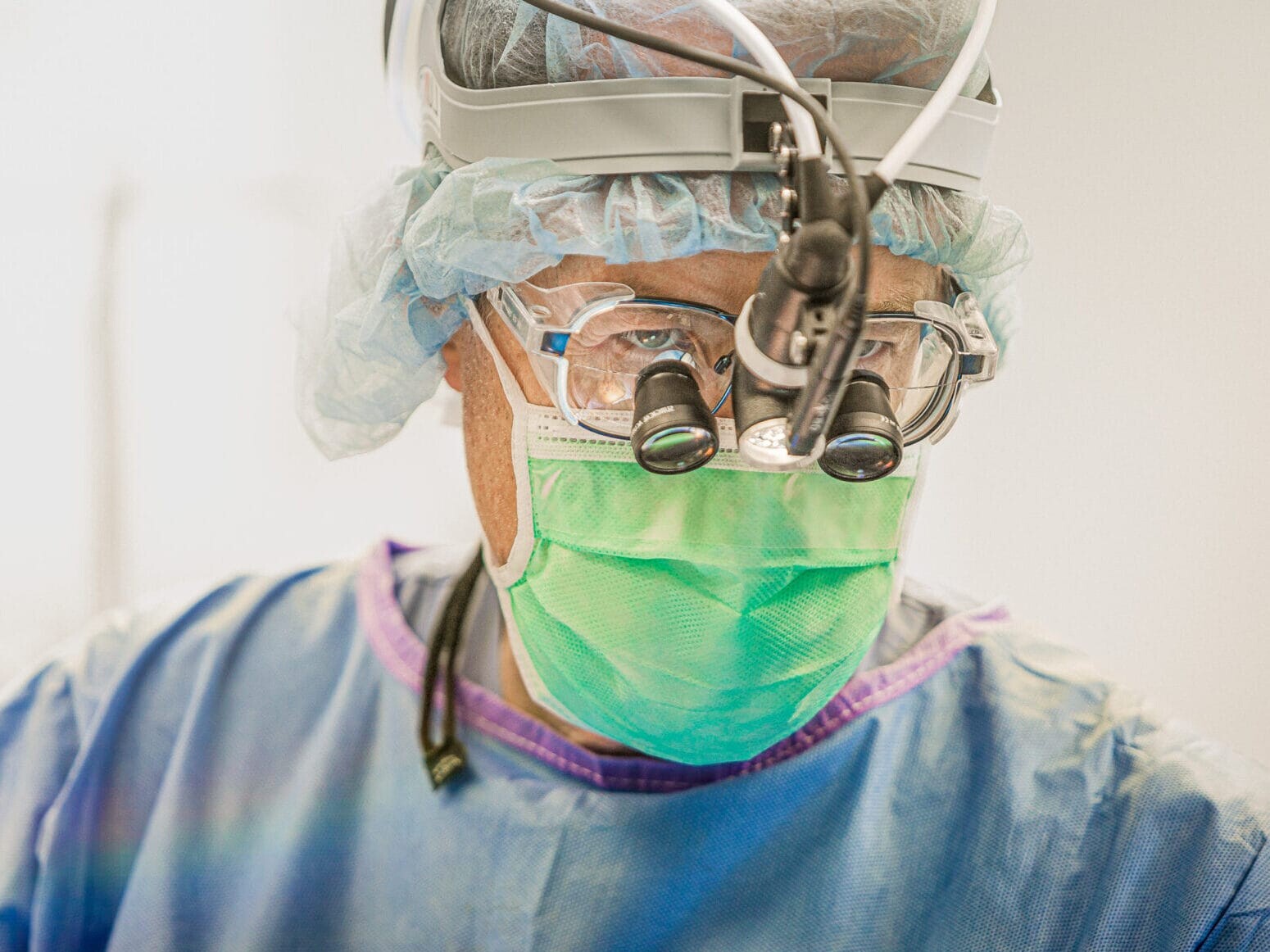 A man wearing a surgical mask for healthcare purposes.
