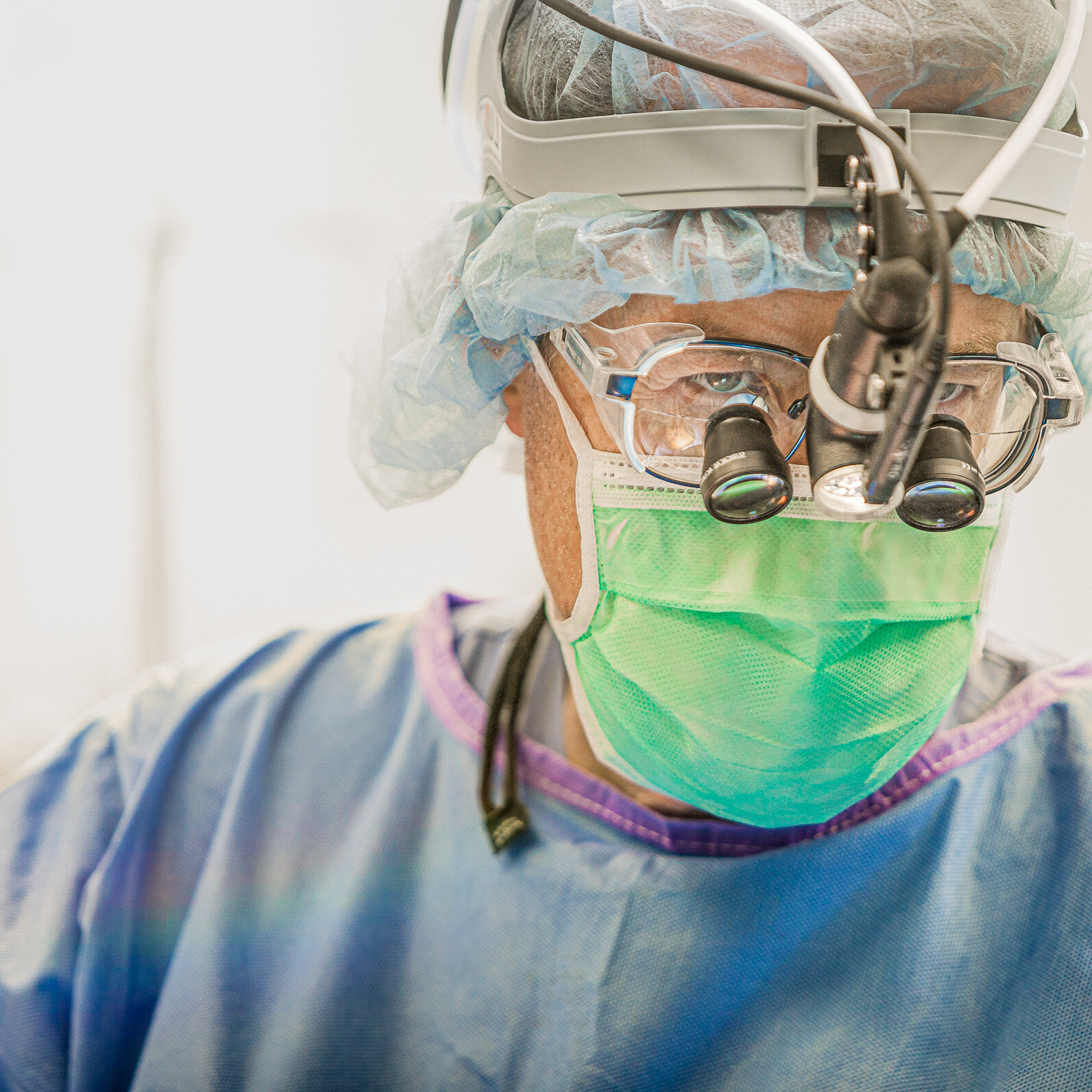 A man wearing a surgical mask for healthcare purposes.